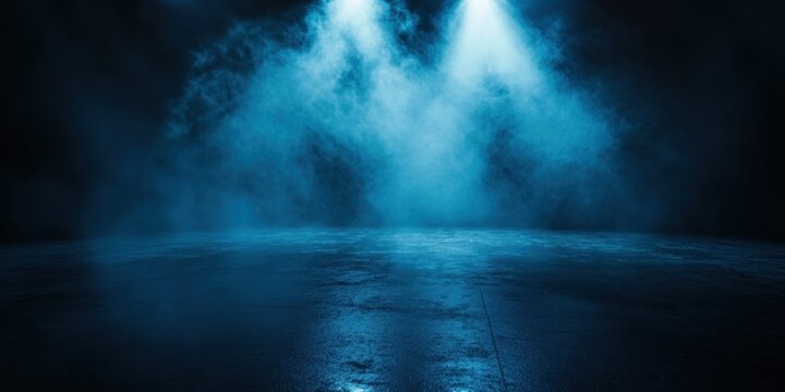 Two bright spotlights illuminate a misty stage with fog