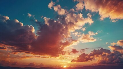 Obraz premium A breathtaking view of a colorful cloudy sky during sunset, featuring a stunning gradient of warm and cool tones. Perfect for nature photography, backgrounds, and atmospheric designs.