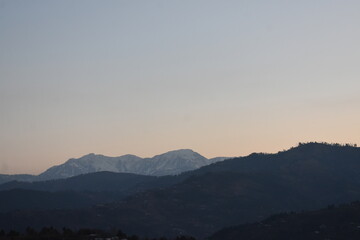 Peaceful Dusk Over Mountain Ranges
