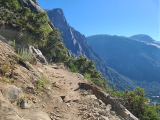 View of granite cliffs surrounding Yosemite Valley on the Yosemite falls trail