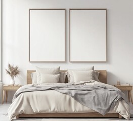 Minimalist bedroom with two blank frames above bed.