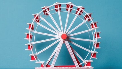 Obraz premium A vibrant miniature ferris wheel captures the joy of amusement parks