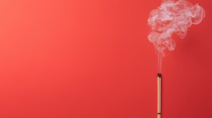 Incense sticks burning with smoke on red background. Aromatherapy concept.