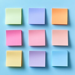 Fototapeta premium Pastel Colored Sticky Notes Arranged on Blue Background