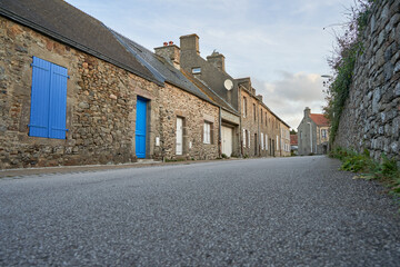 Quaint Breton Houses with Blue Shutters in Normandy Village. France.