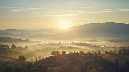 Sunrise over misty Tuscan valley, village, rolling hills. Peaceful landscape for travel, tourism brochures