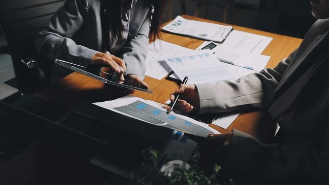 HR team conducting salary benchmarking analysis in a corporate setting