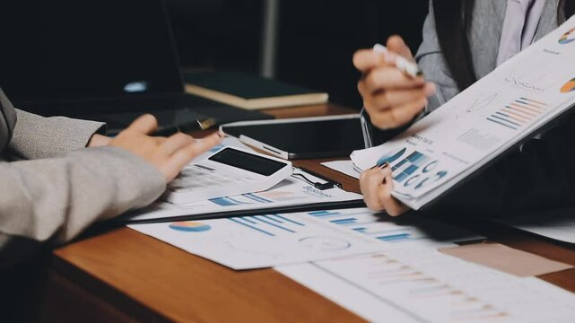 HR team conducting salary benchmarking analysis in a corporate setting