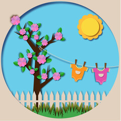 a tree with children's clothes hanging from it