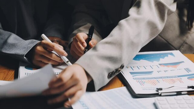 HR team conducting salary benchmarking analysis in a corporate setting
