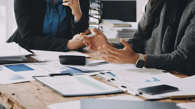 HR team conducting salary benchmarking analysis in a corporate setting