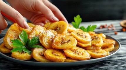 Air fryer clean food cooking easy. Fried plantains garnished with fresh herbs on a dark plate.