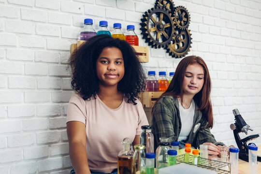Girl is study in the Classroom. Back to school! Cute industrious children are sitting at desks indoors. Kids are learning in class. - Powered by Adobe