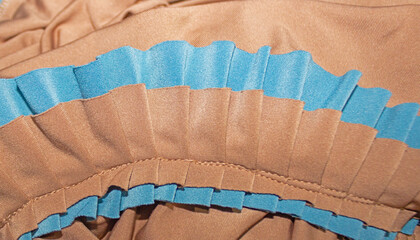 Beige Polyester Satin Fabric with Blue Ruffled Trim and Pleated Texture