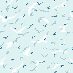 Flock of flying silhouette birds. Birds seamless pattern. White seagulls on a blue background. Vector