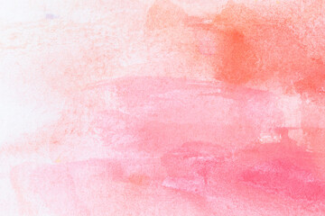 Macro close-up of hand painted orange and pink watercolor gradient fill background with watercolour stains. Abstract high resolution full frame textured paper background. Copy space.