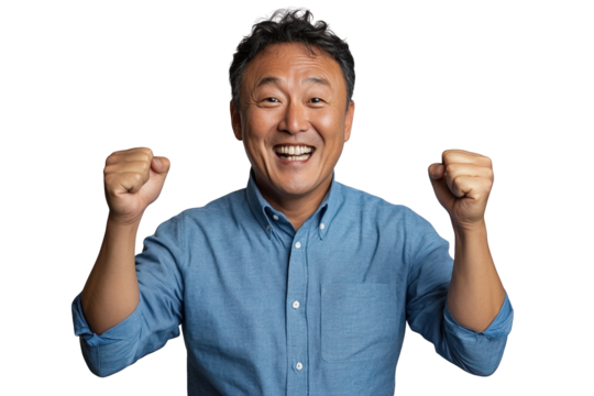 A cheerful man with short hair is celebrating, raising his fists in excitement while wearing a blue shirt.