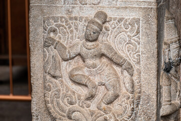 Carved stone relief of dancer in Srirangam temple showcasing intricate artistry from the Sriranganathaswamy temple site