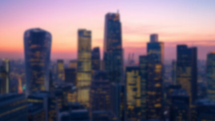 Fototapeta premium Blurred city skyline during sunset with glowing light rays and modern buildings. AI Generated Images