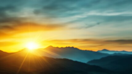 Obraz premium Serene Sunrise Over Misty Mountains with Soft Color Gradients and Radiant Sun Beams