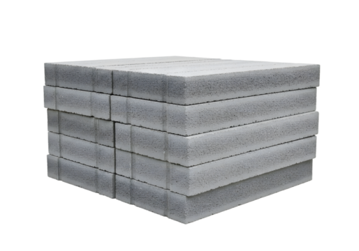 Stack of lightweight concrete blocks arranged neatly on a white background, showcasing construction material for various projects