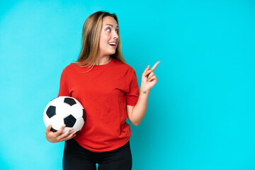 Young football player woman isolated on blue background intending to realizes the solution while lifting a finger up