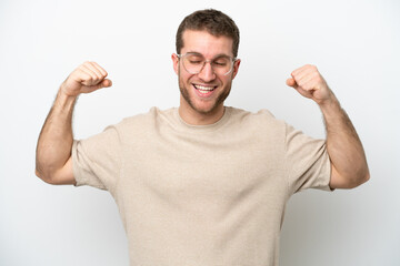 Young caucasian man isolated on white background doing strong gesture