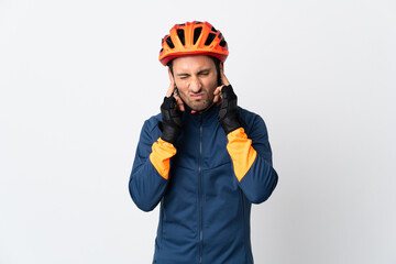 Young cyclist man isolated on white background frustrated and covering ears