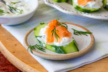 Cucumber and smoked salmon bites with sour cream and dill