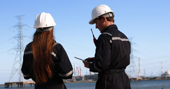 Two mechanical engineers performed detailed inspections and maintenance on a pipeline system that is meticulously designed for the transportation of oil, natural gas, and fuel within an industrial fac