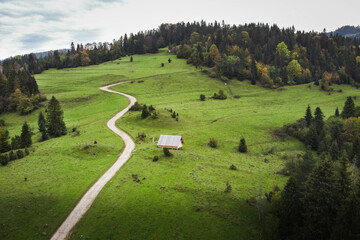 Aerial view of a cozy mountain cabin © ArtemisStudio