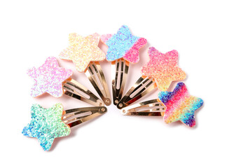 Many cute hair clips isolated on white, top view