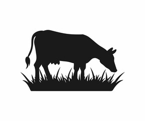 Silhouette of a Cow Grazing in a Field