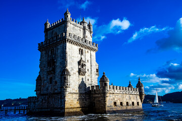 Obraz premium Experience the stunning beauty of Belem Tower as it stands majestically against the vibrant sky in Lisbon, Portugal