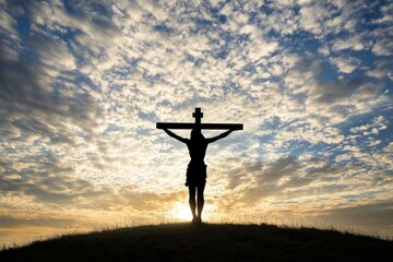 Silhouette of Jesus Christ on the cross, against a sky background with clouds