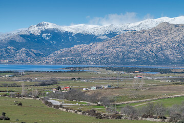 Views of the Santillana Reservoir, in Manzanares el Real, Madrid, Spain. In the background, can be seen Guadarrama Mountains