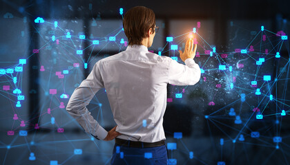 Businessman interacting with digital social network connections in office.
