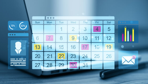 Calendar on laptop screen with business data.