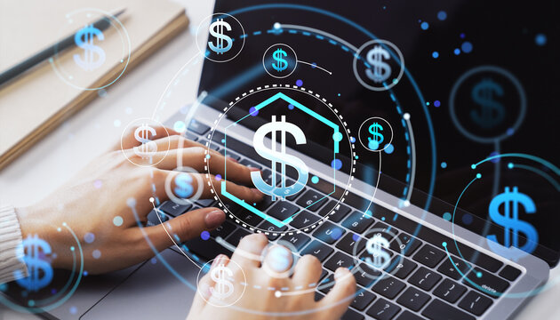 Digital Finance Concept with Holographic Dollar Symbols on Laptop Keyboard.