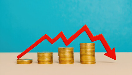 Rising coins with downward trend line symbolize financial decline and market analysis