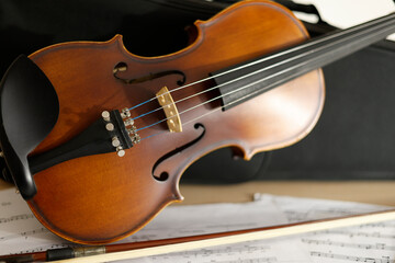 Fototapeta premium violin and violin bow with music sheet