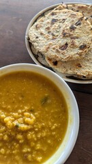 Traditional Sri Lankan red lentil dahl curry and coconut roti cuisine food