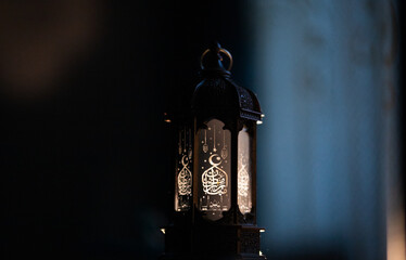 ornamental Arabic lantern Ramadan and Eid al-Fitr greeting card. The arabic calligraphy translation...