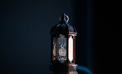 ornamental Arabic lantern Ramadan and Eid al-Fitr greeting card. The arabic calligraphy translation...