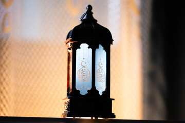 ornamental Arabic lantern Ramadan and Eid al-Fitr greeting card. The arabic calligraphy translation...
