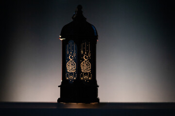 ornamental Arabic lantern Ramadan and Eid al-Fitr greeting card. The arabic calligraphy translation...