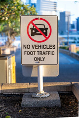 A sign advising that cars are not allowed, only foot traffic