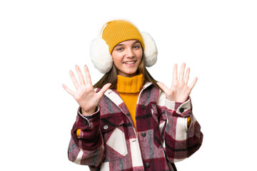 Teenager caucasian girl wearing winter muffs over isolated background counting ten with fingers