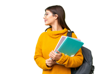 Young student woman over isolated chroma key background looking side