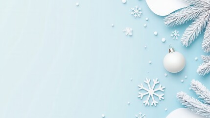 Fototapeta premium Winter holiday background with snowflakes and fir branches on light blue.